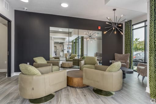 A living room with a large sectional sofa and a wooden coffee table.