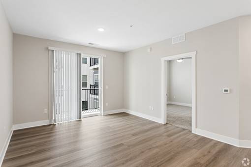 Living area with a patio/balcony of an apartment home at Tiffany Flats in Columbus, OH.