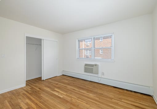 A room with a window and a door.