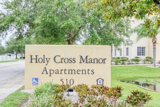 Monument sign at entrance to Holy Cross Manor I in Palmetto, FL