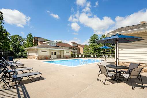 Swimming Pool And Relaxing Area at The Apartments at Elmwood Terrace, Frederick