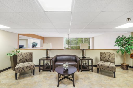 sitting area with comfortable love seat, chairs, and coffee table