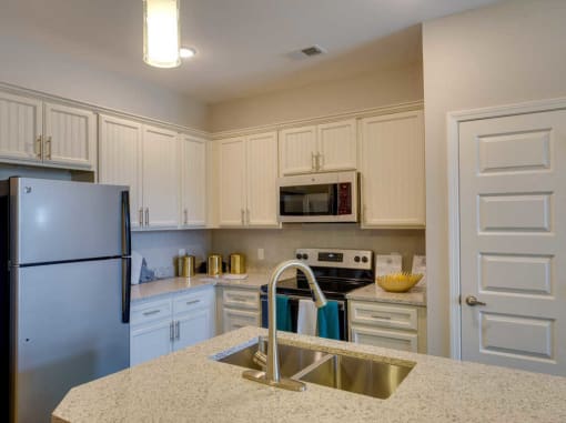Fully Equipped Kitchen Includes Frost-Free Refrigerator, Electric Range, & Dishwasher at Evolve at Tega Cay, Fort Mill, SC, 29708