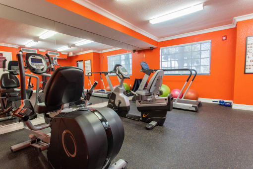 fitness center with work out equipment 
