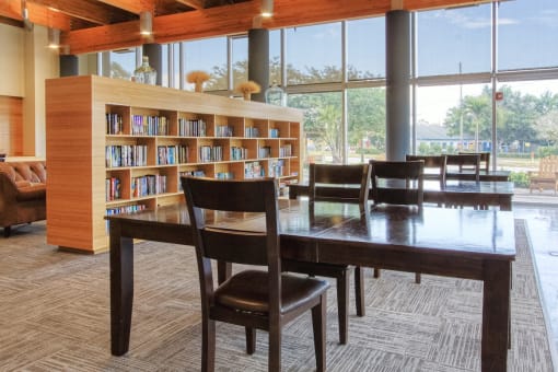 large book shelves with plenty of reading material and reading tables