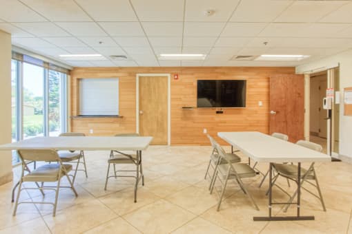 community room with tables and TV