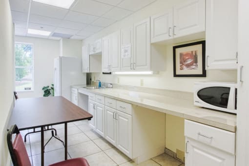 Community kitchen with microwave at St. Giles Manor
