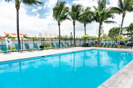swimming pool with lake views at Crystal Lake Apartments