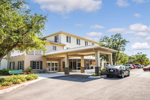 covered drive up entrance to Villa Vincente Senior Apartments in Fort Myers, FL