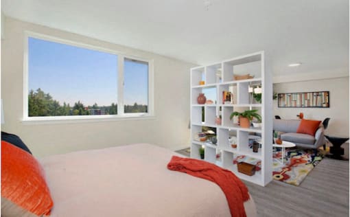Studio Apartment with Bedroom View and Book Shelf separating living area at Arabella Apartment Homes, Shoreline, 98155