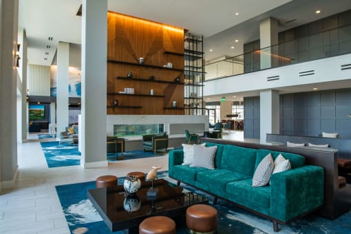 atrium with long teal couches and brown coffee tables at The Apex at CityPlace, Kansas