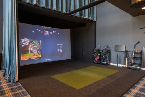 Indoor virtual golf game with grass pad and giant projector screen at The Apex at CityPlace, Overland Park, KS, 66210