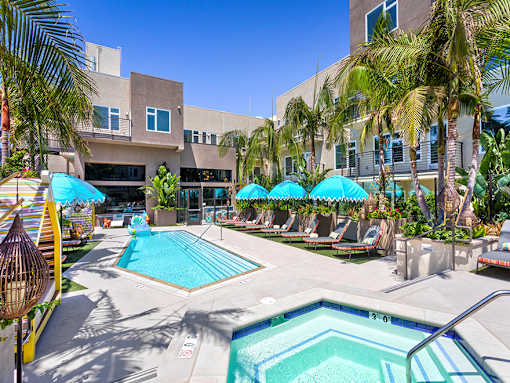 Outdoor lounge area, pool and hot tub at Vida North Park, San Diego, California