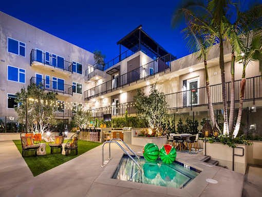 Outdoor lounge area and hot tub at Vida North Park, San Diego
