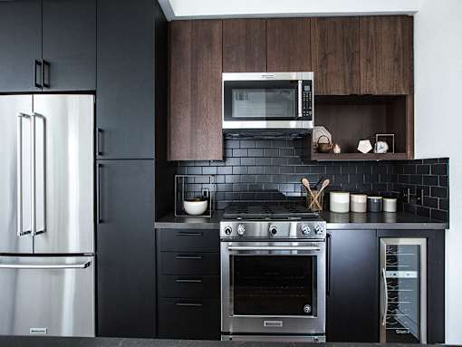Kitchen with stainless steel appliances at Vida North Park, California, 92104