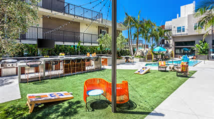Outdoor lounge area and pool at Vida North Park, San Diego