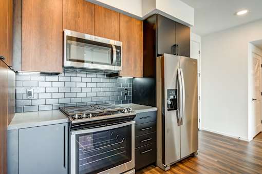Kitchen with stainless steel appliances at Vida North Park, San Diego, 92104