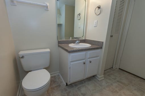 bathroom with vinyl tile flooring