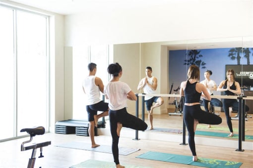 Yoga in gym at apartment building at Wilshire Vermont, Los Angeles, CA 90010