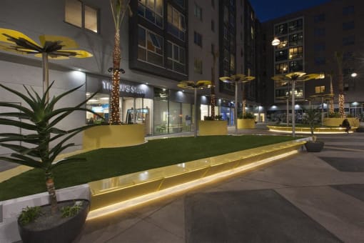 Exterior during nighttime at apartment building at Wilshire Vermont, Los Angeles, CA 90010