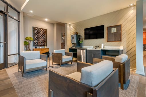 Clubhouse interior with seating area at lounge at JTB Apartments, Jacksonville
