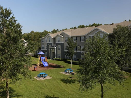 Courtyard With Playground at Camri Green Apartments, Florida