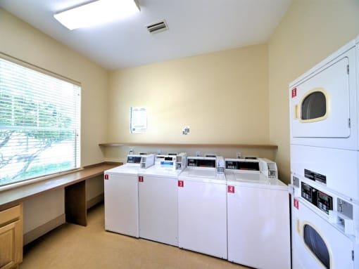 Clothing care center with washers, dryers, and folding station