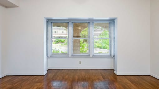 Living room with hardwood flooring and windows