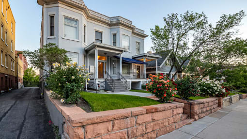 Light blue side exterior of First Avenue Home