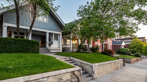 Side exterior of First Avenue Home that is blue and white