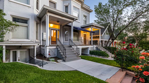 Front exterior view of white First Avenue Home