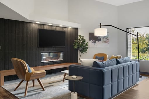 Lounge seating area with TV mounted over Fireplace