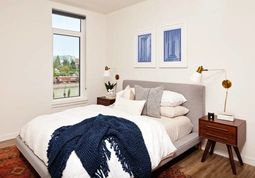Bedroom with queen bed and window
