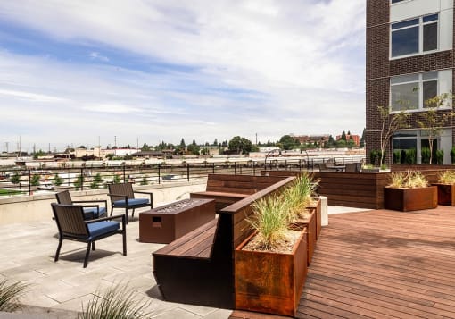 Outdoor fire places, with benches and chairs on courtyard