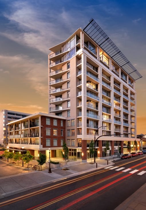 a rendering of an apartment building on a city street. #victoria #rentals #affordable #appartments