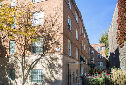 Barry Court brick building with a tree in front of it