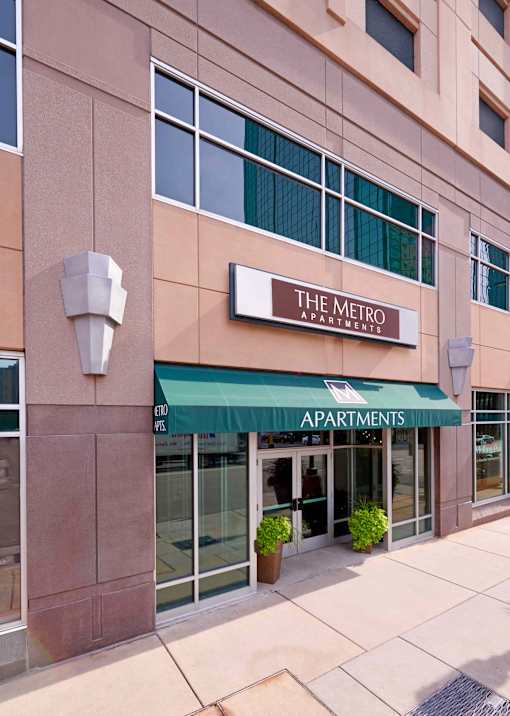 The Metro Apartments building has a green awning.