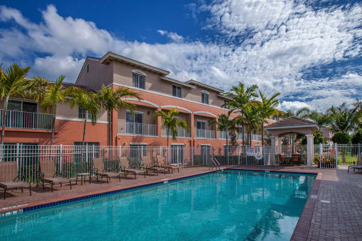 Preserve at Boynton Beach resort style pool with lounge chairs at Preserve at Boynton Beach, Boynton Beach, FL, 33435