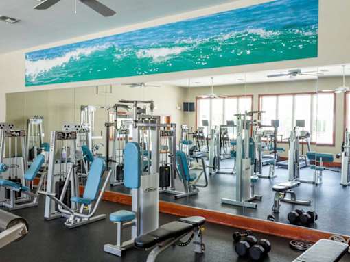 interior fitness center with resistance machines and free weights
