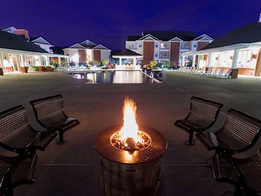 outdoor firepit at night social and entertaining spaces at 1200 Acqua