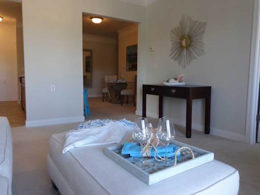 alternate angle of living room in decorated model at 900 Acqua