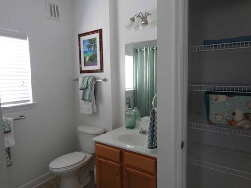 bathroom and storage area in apartment home at 900 Acqua