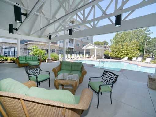covered outdoor lounge with furniture