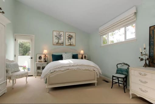 bedroom with bed and blue pillows