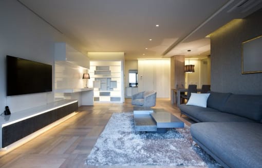 a living room filled with furniture and a flat screen tv