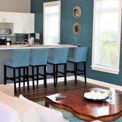 a living room with a kitchen and a table at Hidden Creek, Morrow, GA