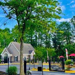 a house behind a fence and a tree at Hidden Creek, Morrow, 30260