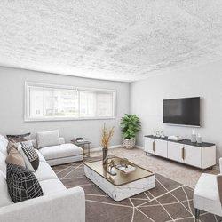 a living room with a couch and a tv at Uphill Flats, Decatur