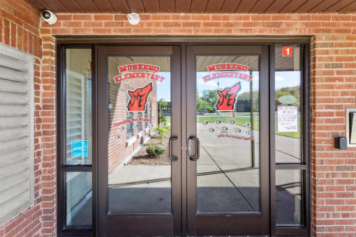 the secured access entry to Muskego School Apartments main building