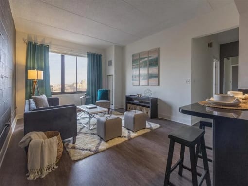 a living room with a couch and a bar in a room
